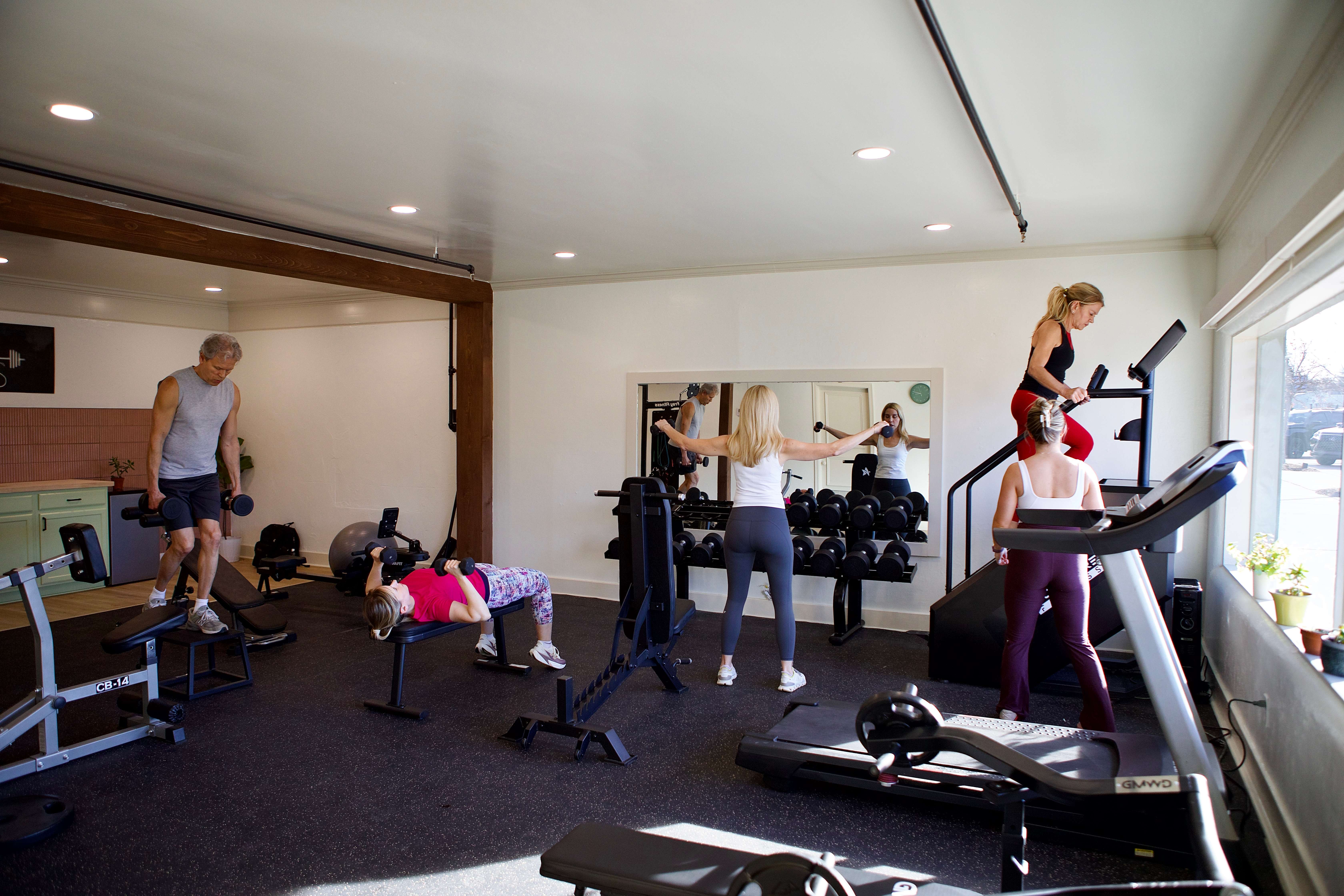 Semi-private strength training session at Ketch Wellness in Oklahoma City — small group of women lifting weights with personal trainer Hannah Ketch coaching form