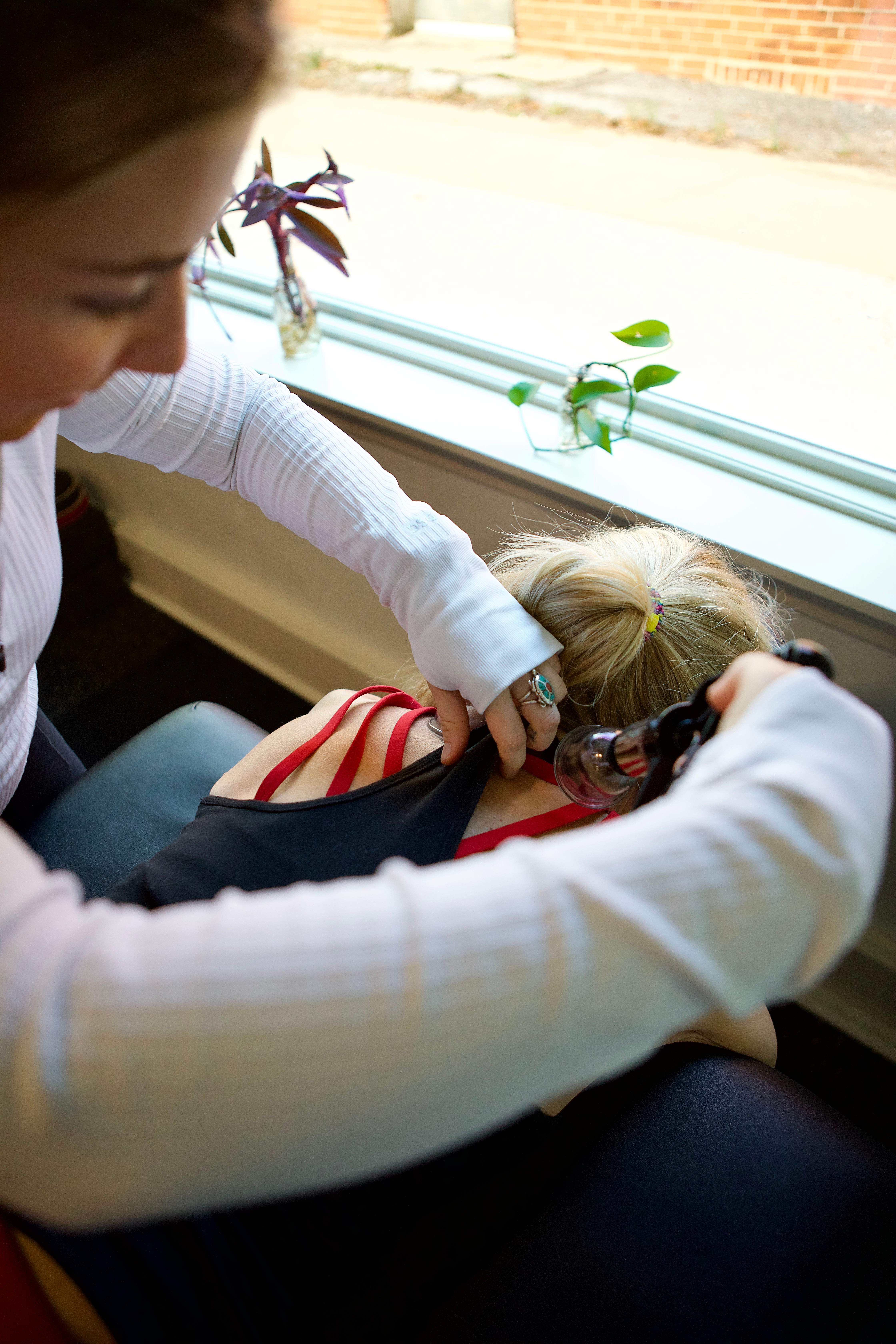 Certified personal trainer Hannah Ketch providing one-on-one form correction and recovery guidance to a client at Ketch Wellness in Oklahoma City